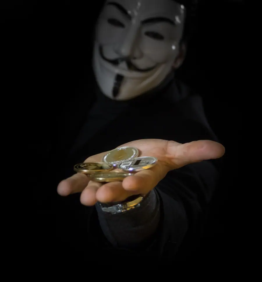 A figure in a mask holding out a handful of crypto coins, illustrating cryptocurrency fraud